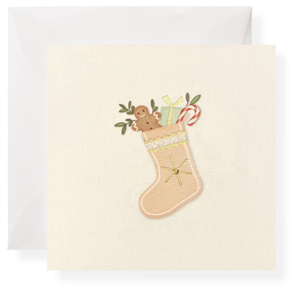 Christmas card with a stocking design featuring a gingerbread man and candy cane on a white background.
