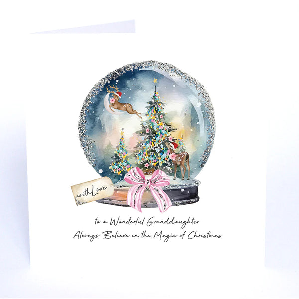 Christmas card with a snow globe design featuring reindeer and a tree, on a white background.