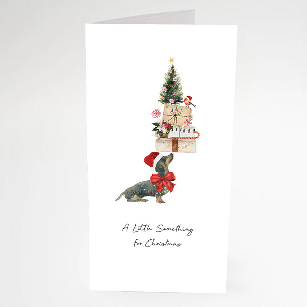 Christmas card with a dachshund and Christmas tree design on a white background