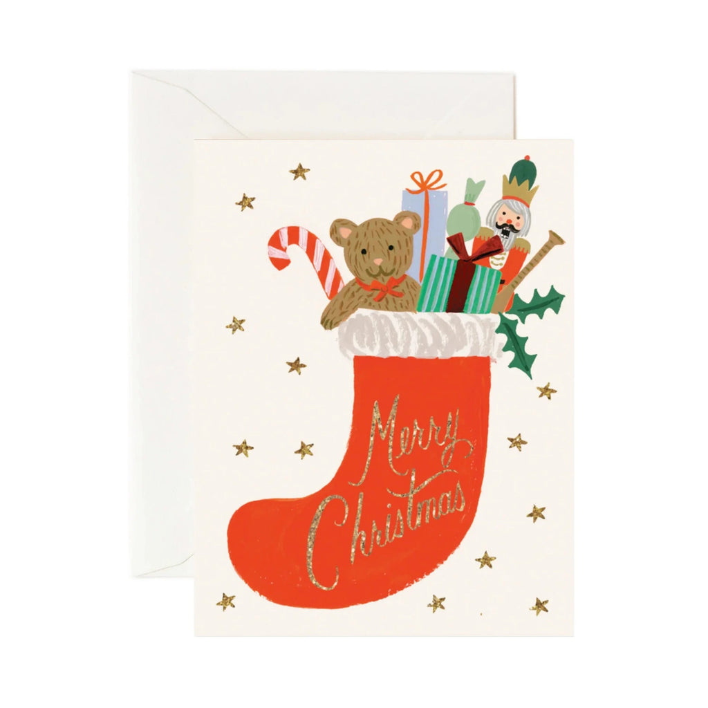 Christmas card with a red stocking, teddy bear, and Santa Claus on a white background