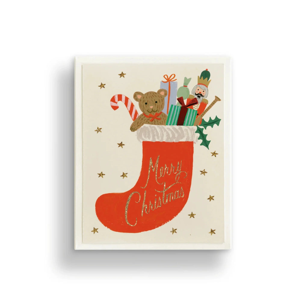 Christmas-themed illustration with a stocking, teddy bear, and presents on a white background.