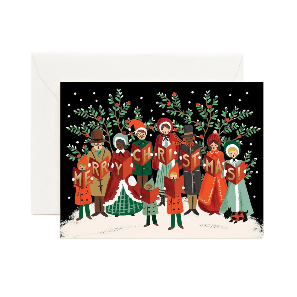 Christmas card with people holding 'Merry Christmas!' signs and holly leaves.