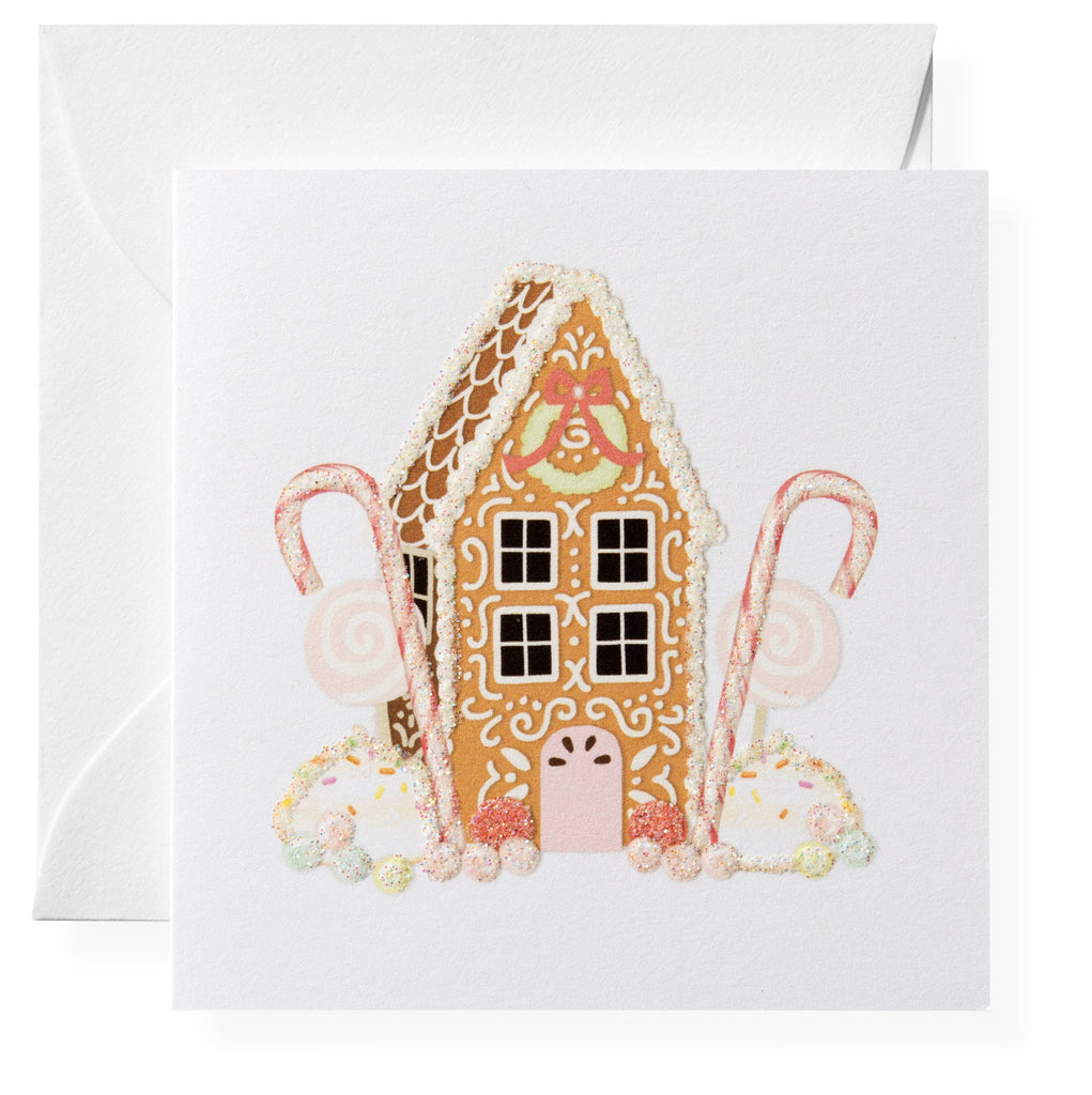 Greeting card with a gingerbread house design on a white background