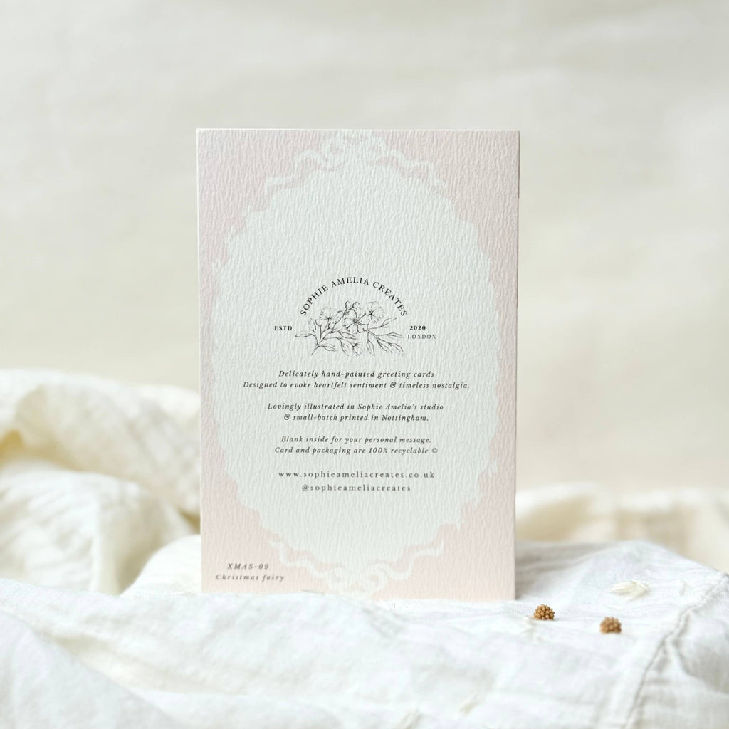 Card with text and floral design on a soft white background