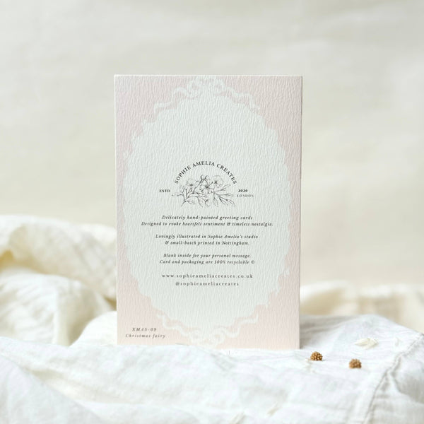 Card with text and floral design on a soft white background
