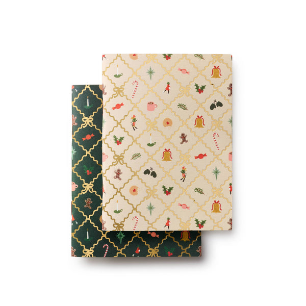 Two patterned notebooks stacked on a white background