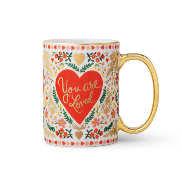 Mug with floral design and 'You are Loved' text on a white background