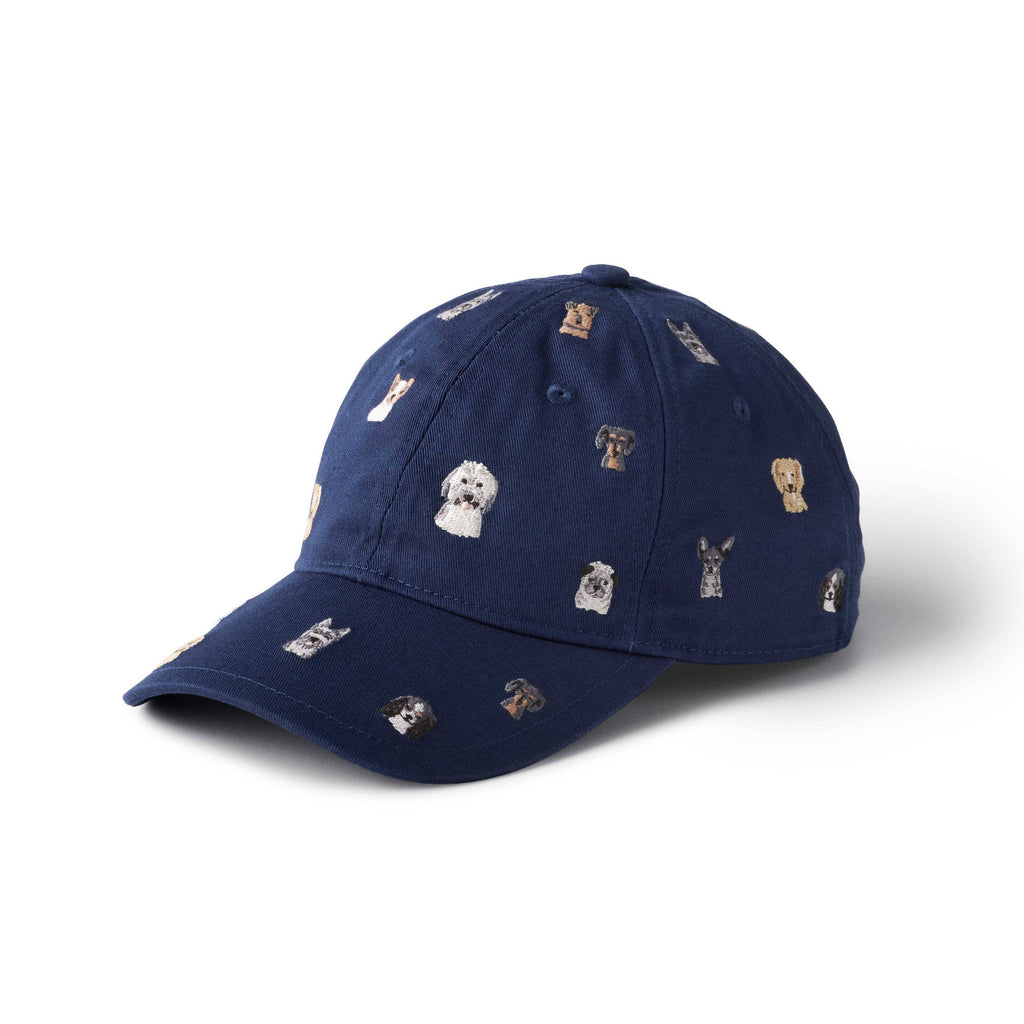 Navy blue cap with small dog illustrations on a white background