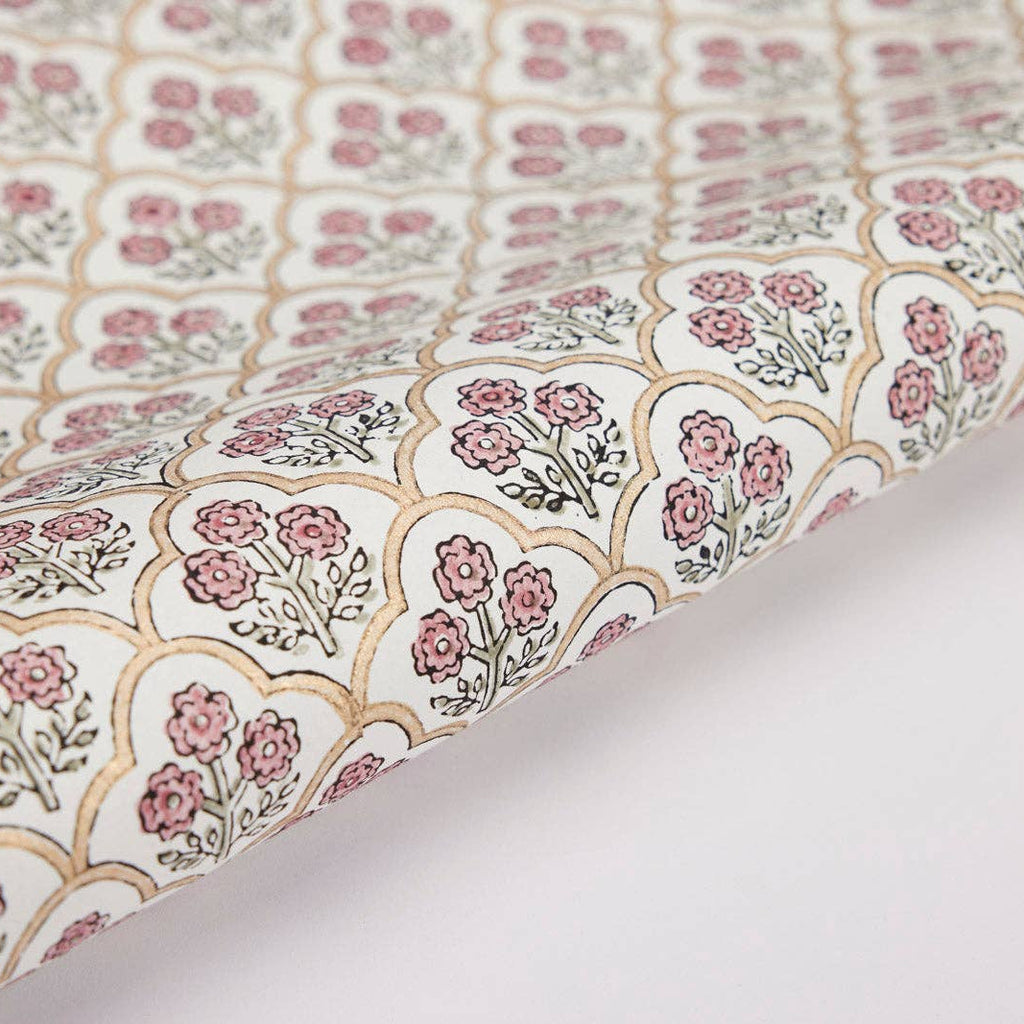 Floral patterned fabric with pink flowers on a white background