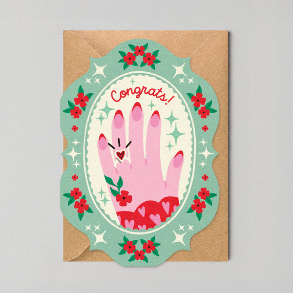 Greeting card with hand illustration and 'Congrats!' text on a gray background