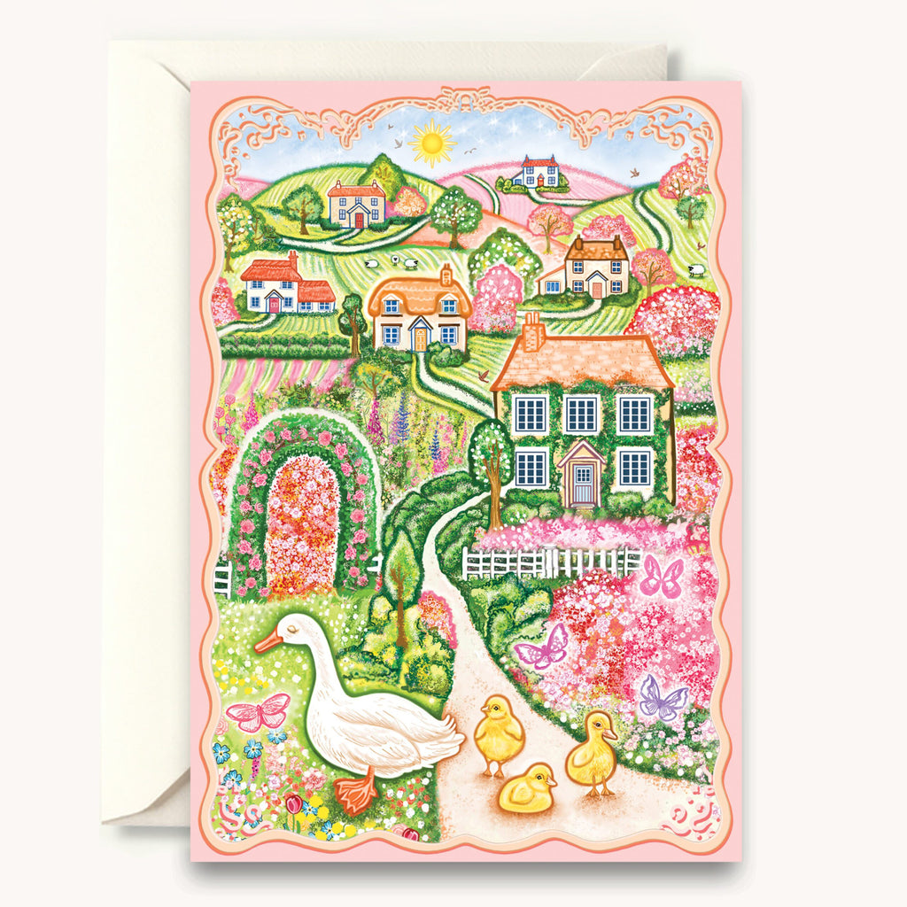 Colorful illustration of a village scene with houses, ducks, and flowers on a card.