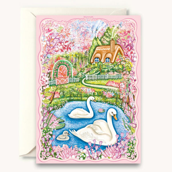 Greeting card with a colorful illustration of swans, a garden, and a house on a pink border.