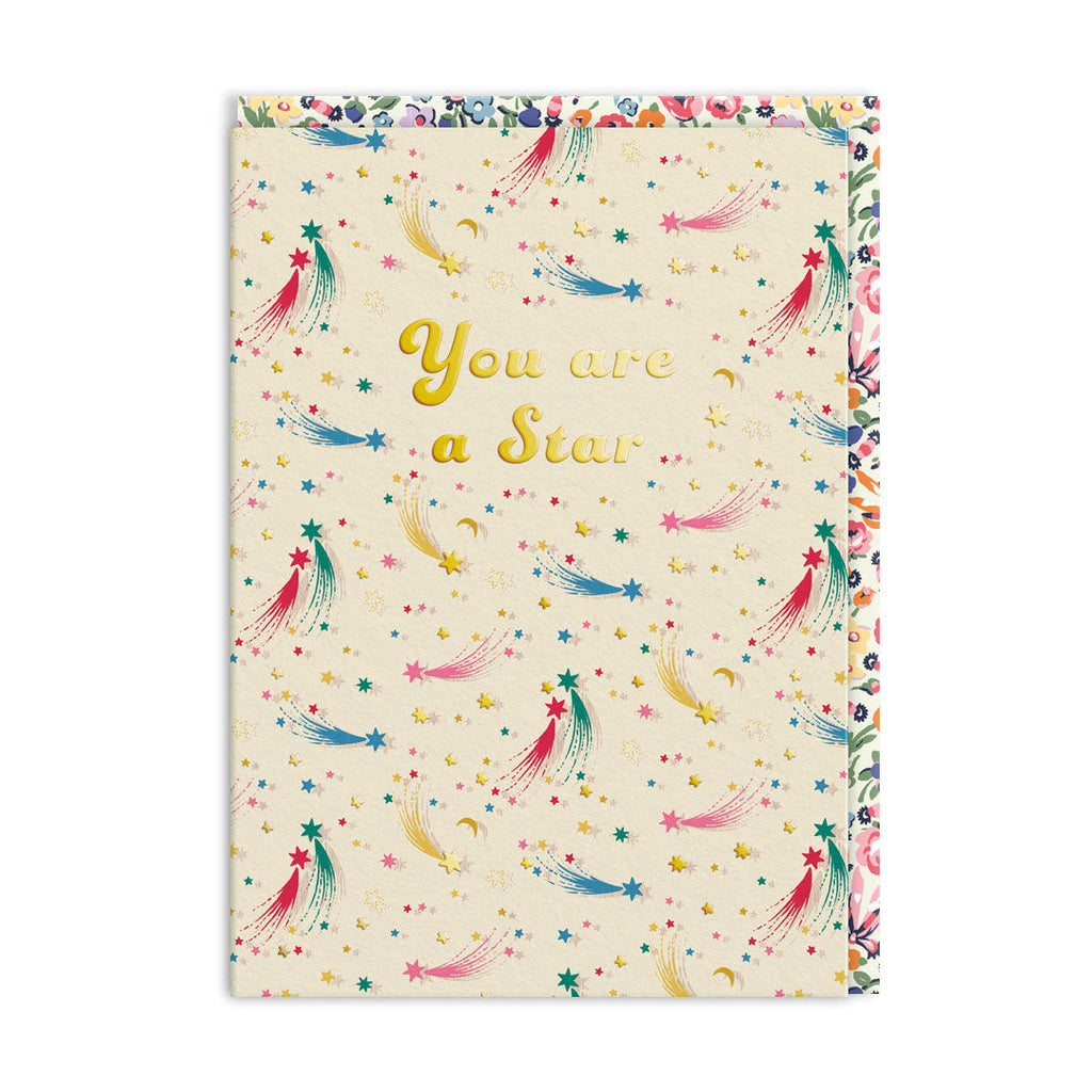 Notebook with colorful star pattern and 'You are a Star' text on a white background
