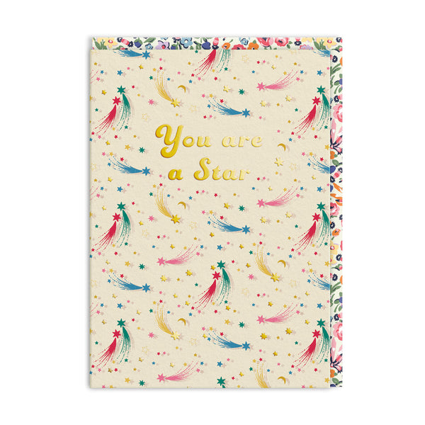 Notebook with colorful star pattern and 'You are a Star' text on a white background