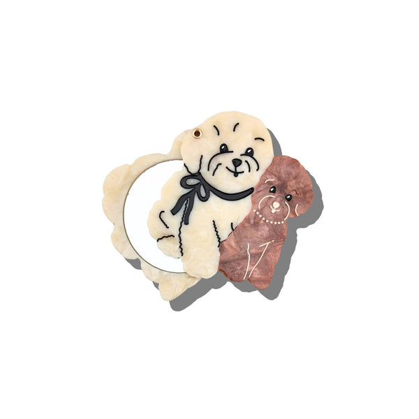 Decorative hair clip with a dog and a cat design on a white background