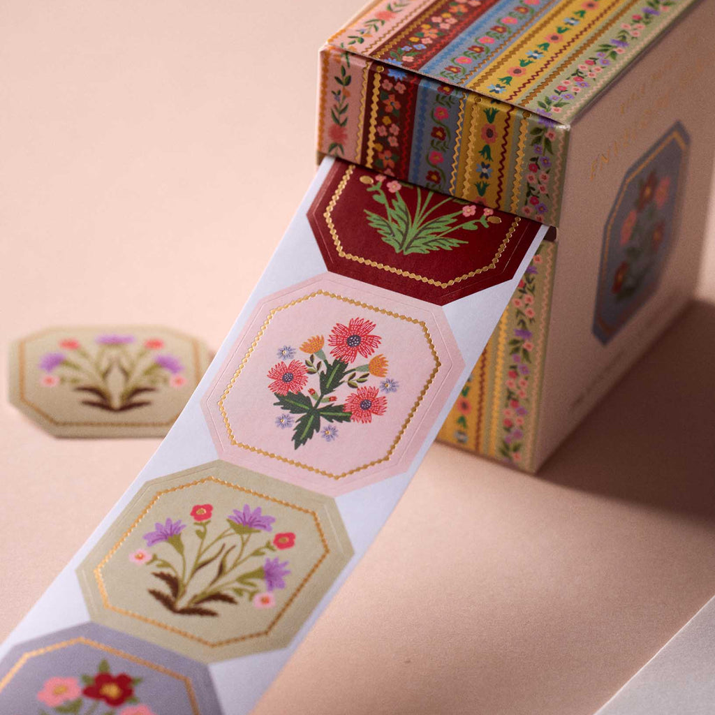 Decorative tape with floral designs on a pink background
