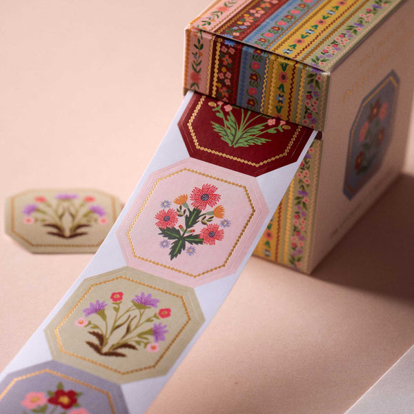 Decorative tape with floral designs on a pink background
