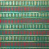 Patterned fabric with red and beige shapes on a green background