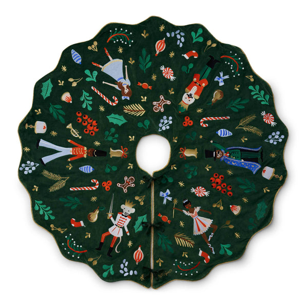 Decorative Christmas tree skirt with colorful designs on a white background