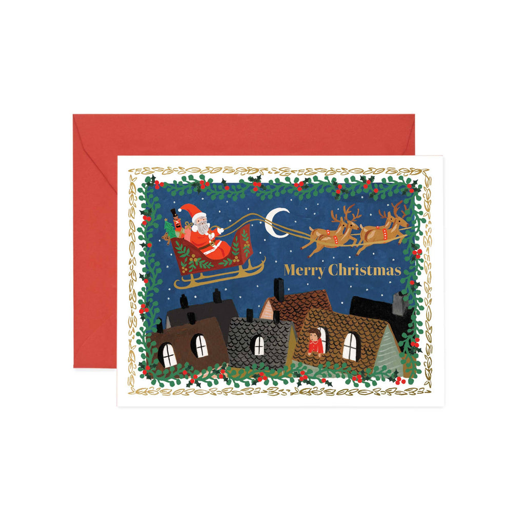 Christmas card with Santa Claus in a sleigh over a village, on a white background.