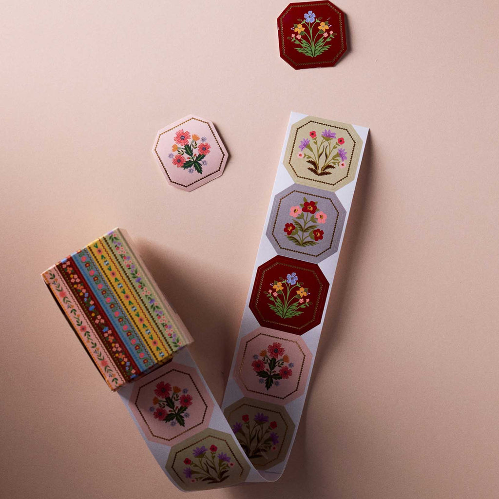 Decorative stickers with floral designs on a beige background