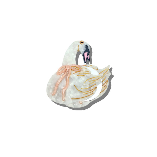 Decorative swan figurine with a nest on a white background