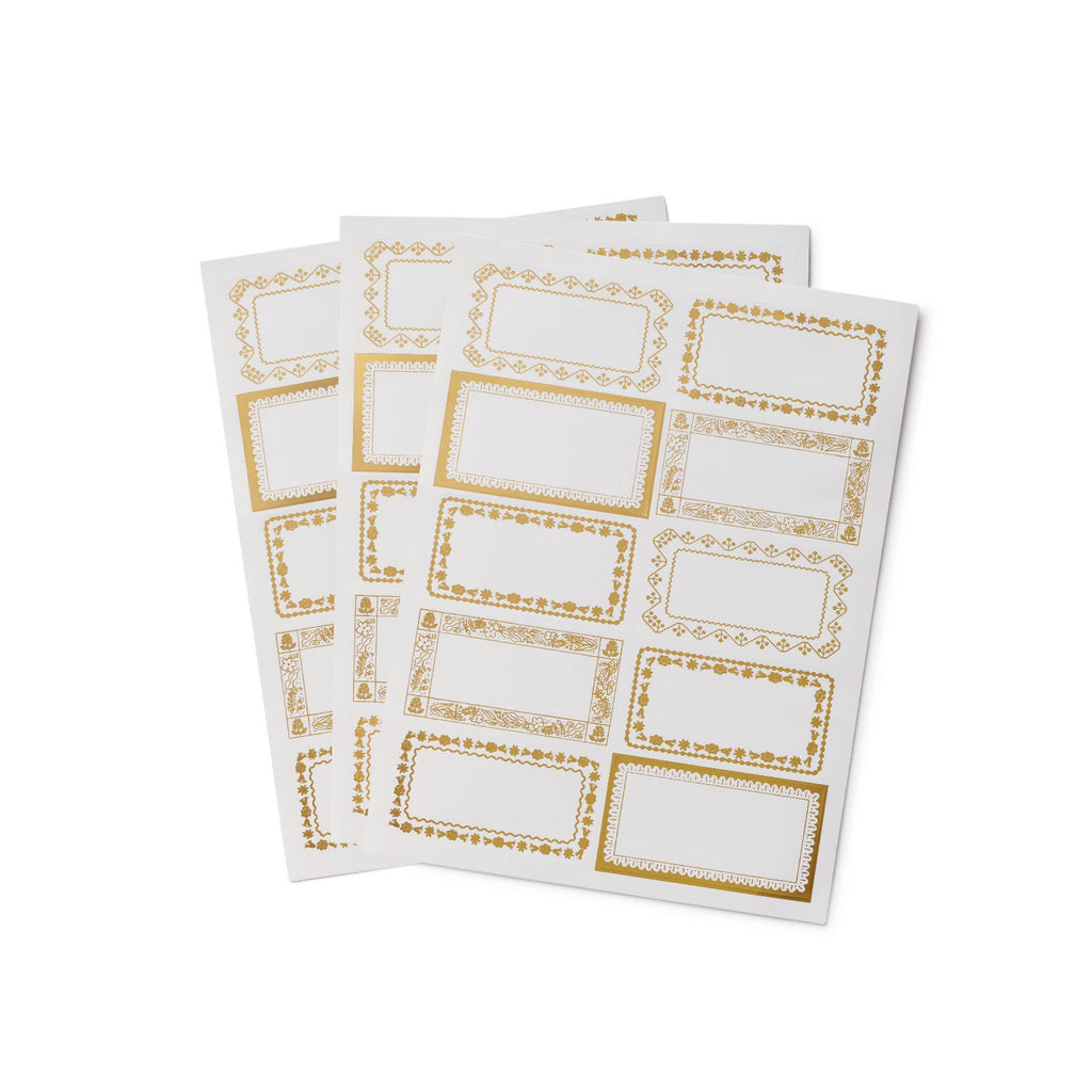 Sheet of white labels with gold borders on a white background