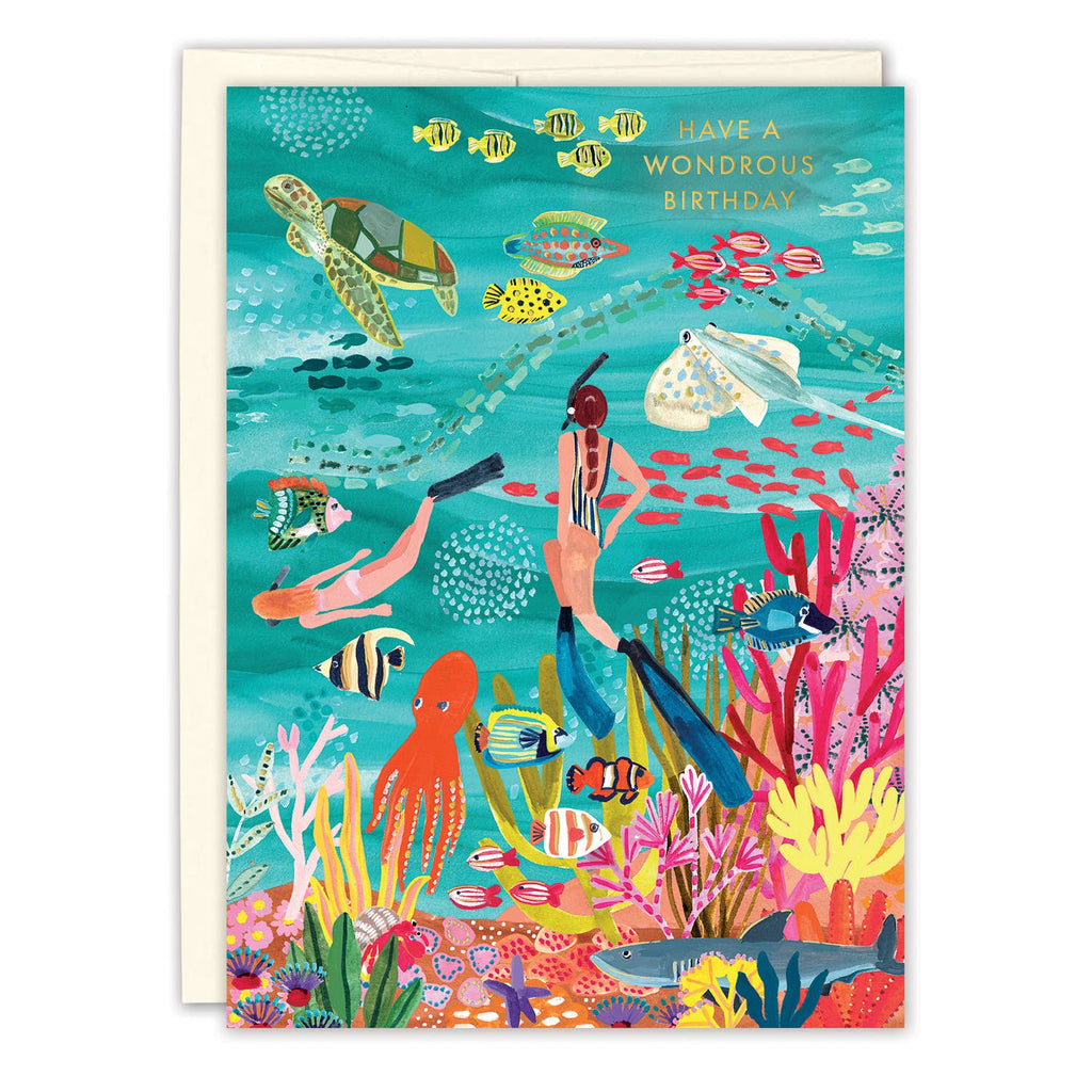Colorful underwater scene with marine life and scuba divers on a birthday card.