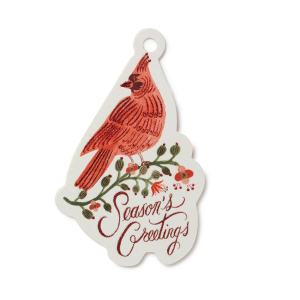 Decorative tag with a red cardinal and floral design on a white background