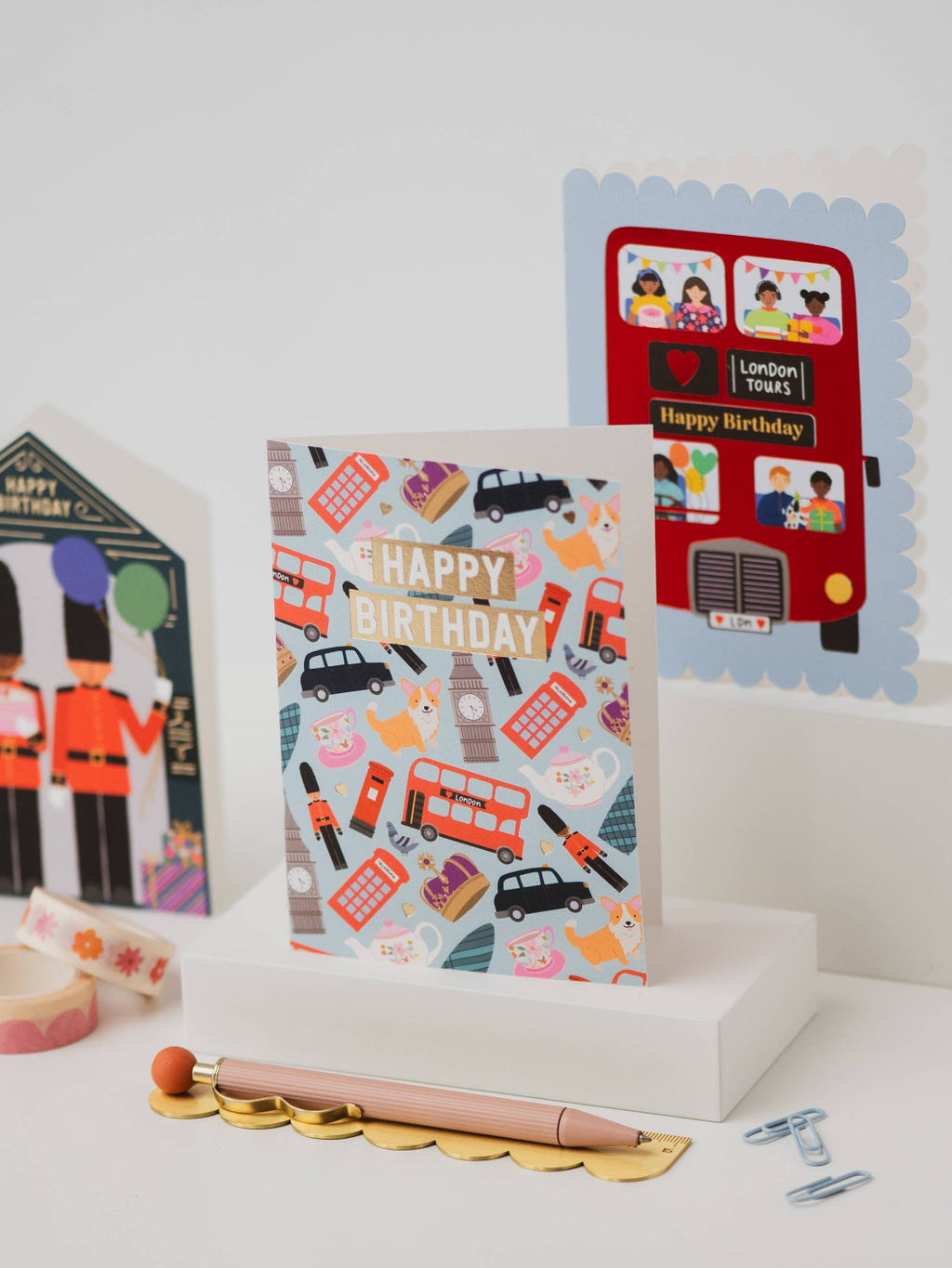 Collection of birthday cards with London-themed designs on a white surface.