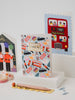 Collection of birthday cards with London-themed designs on a white surface.