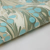 Marbled paper with blue and green patterns on a white background