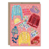 Greeting card with colorful winter clothing illustrations and 'Warm Winter Wishes' text on a pink background.
