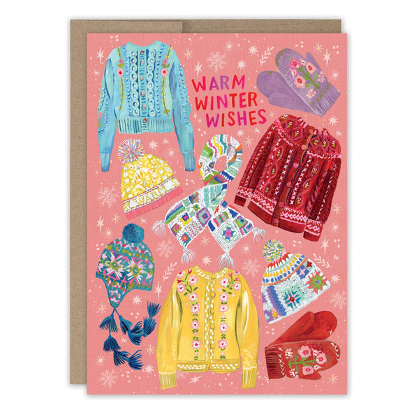 Greeting card with colorful winter clothing illustrations and 'Warm Winter Wishes' text on a pink background.