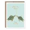 Greeting card with two turtles and text on a light blue background