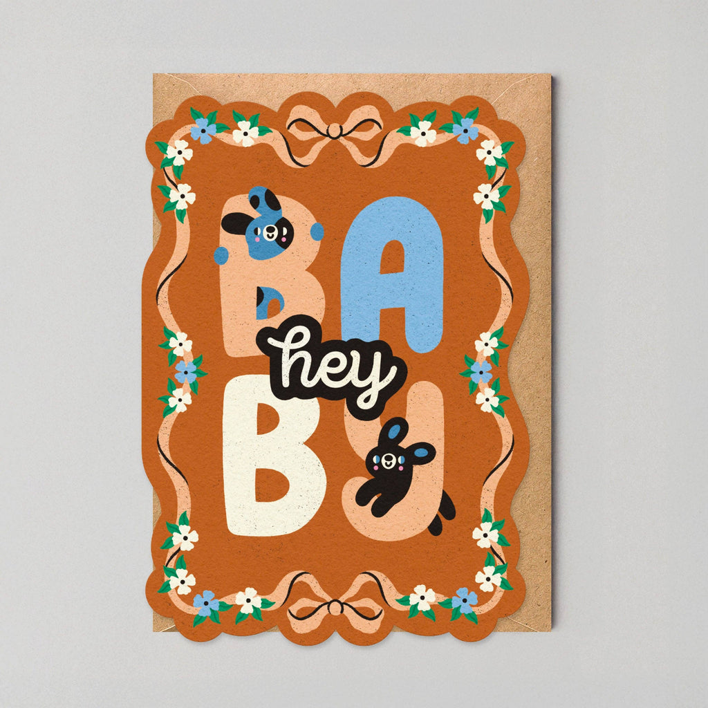 Card with 'hey baby' text and decorative elements on a gray background
