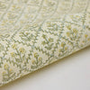 Roll of fabric with floral pattern on a white background