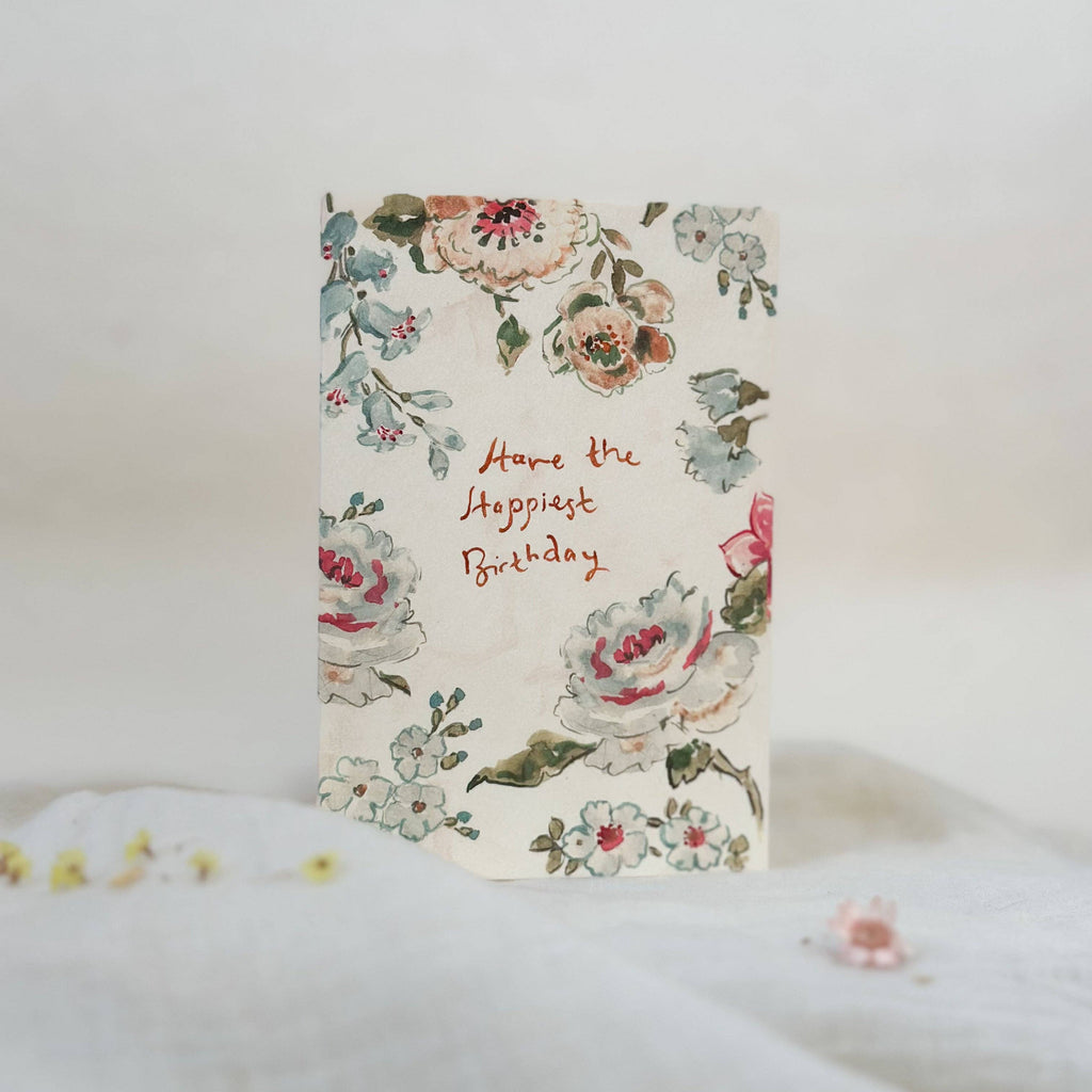 Floral birthday card on a white surface