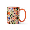 Mug with Halloween-themed geometric pattern on a white background
