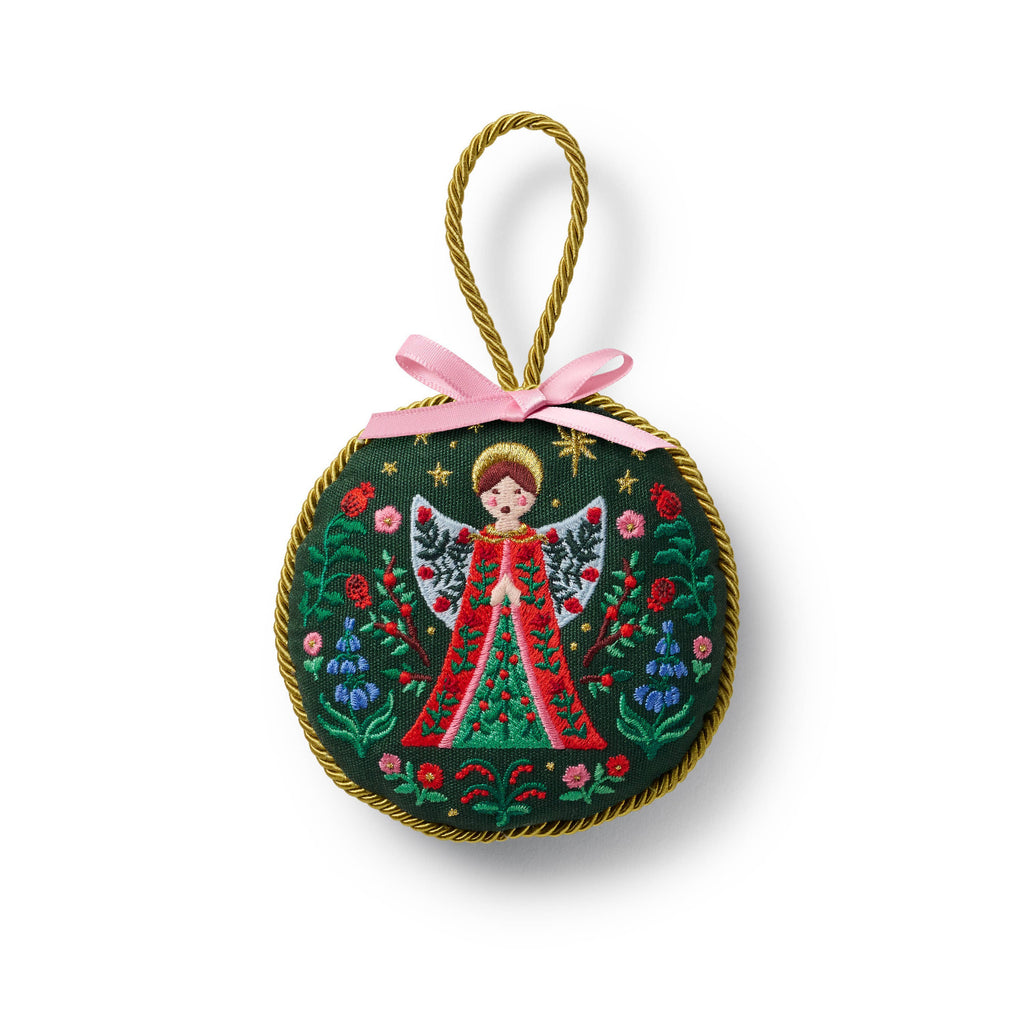 Decorative angel ornament with floral designs on a white background
