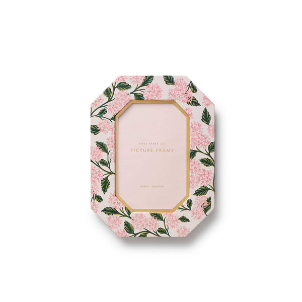 Floral-patterned picture frame on a white background