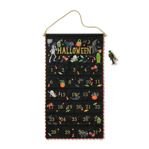 Halloween-themed Advent calendar with decorative elements on a white background