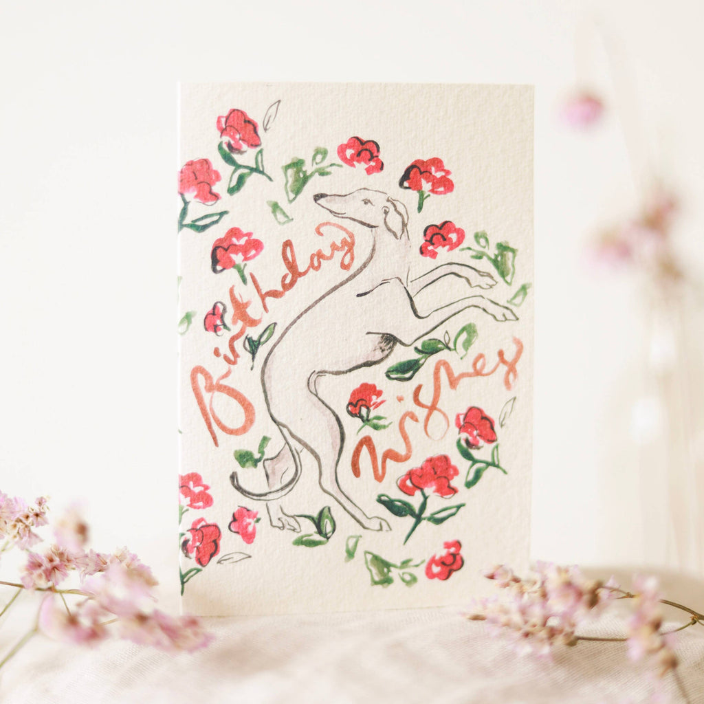 Greeting card with a kangaroo illustration and floral elements on a light background