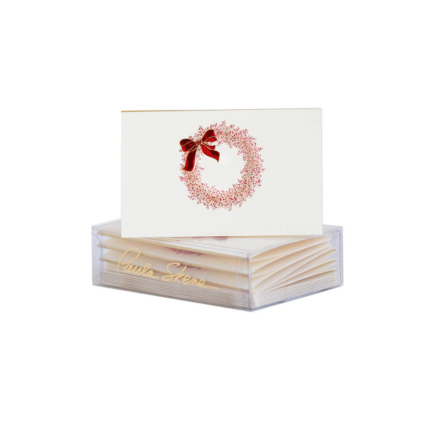 Set of cards with a decorative design and a clear stand on a white background