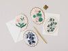 Set of floral cards with envelopes on a light gray background