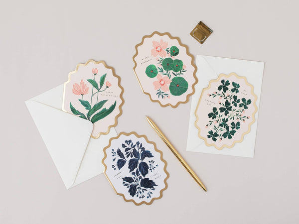 Set of floral cards with envelopes on a light gray background