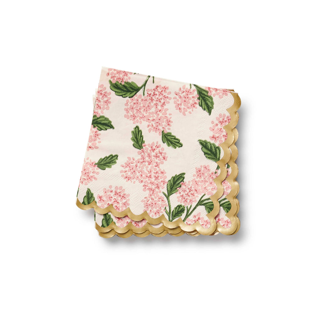 Floral-patterned napkin with scalloped edge on a white background