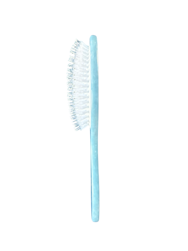 Blue toothbrush with white bristles on a white background