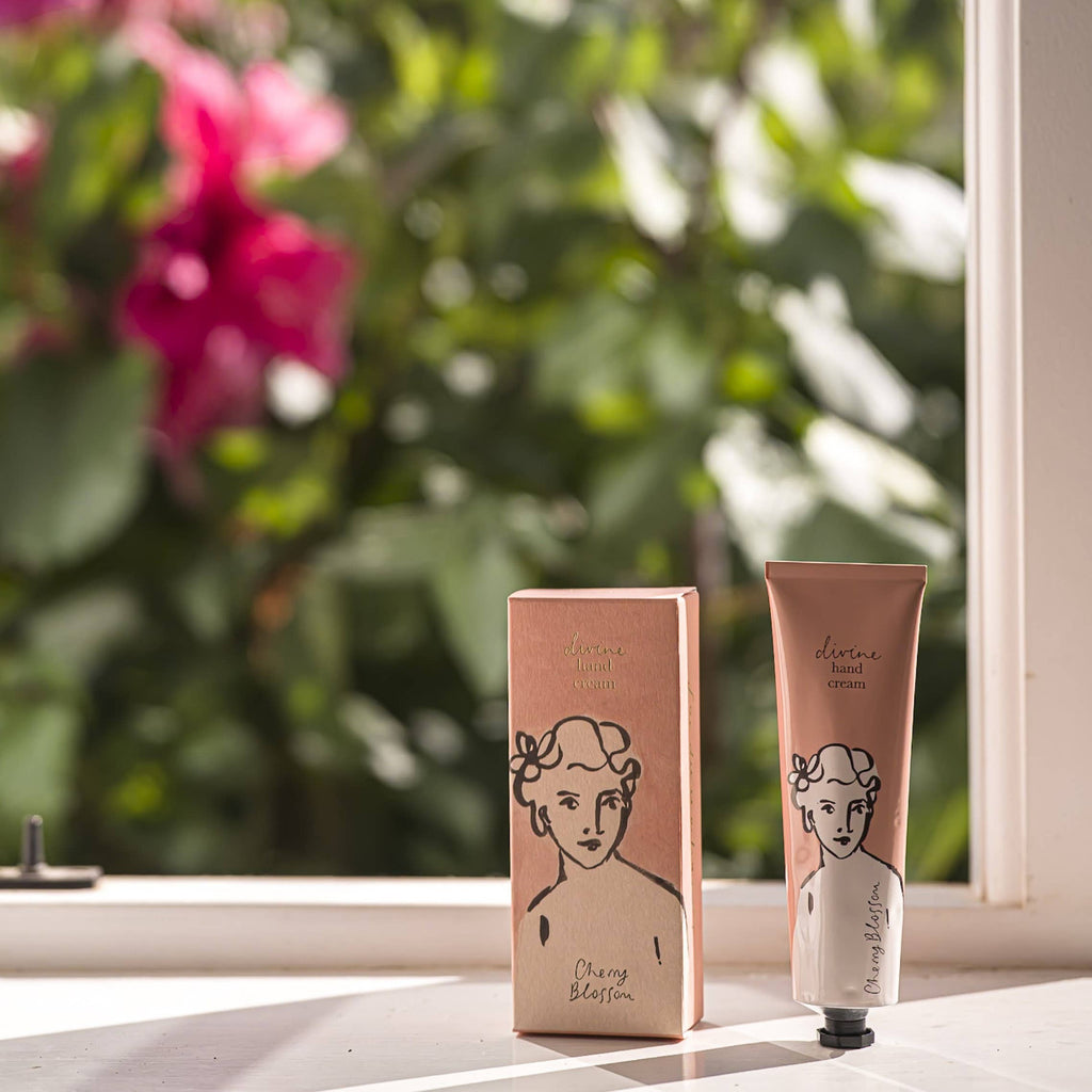 Cosmetic packaging with a tube and box on a surface with a blurred green background