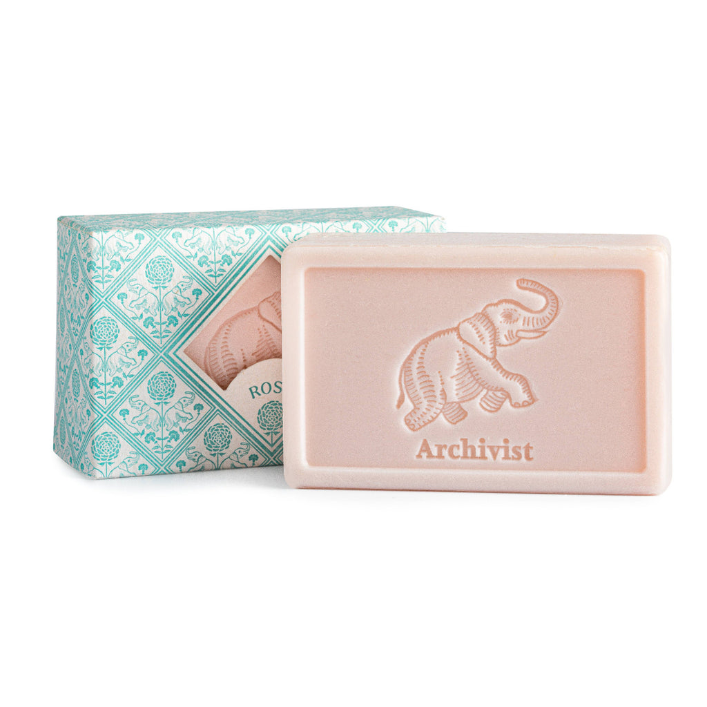 Bar of soap with 'Archivist' branding and decorative packaging on a white background